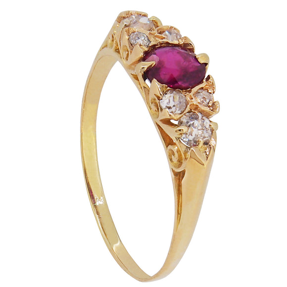 An Edwardian, 18ct yellow gold, ruby & diamond set seven stone ring
