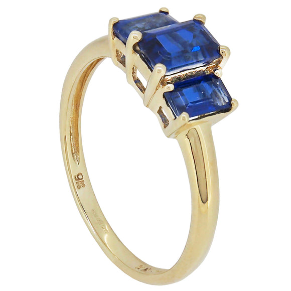 A modern, 9ct yellow gold, blue kyanite set, three stone ring