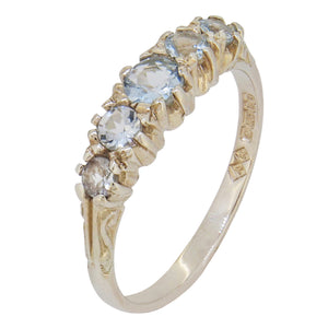 A modern, 9ct white gold, aquamarine set, five stone ring