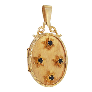 A modern, 9ct yellow gold, sapphire set, four stone, oval locket