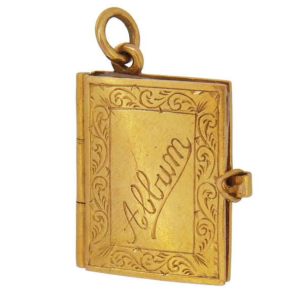 A mid-20th century, 15ct yellow gold, 'Album' book charm pendant, with fold out pages