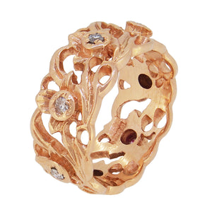 A modern, 14ct yellow gold, diamond set, open scrollwork band ring