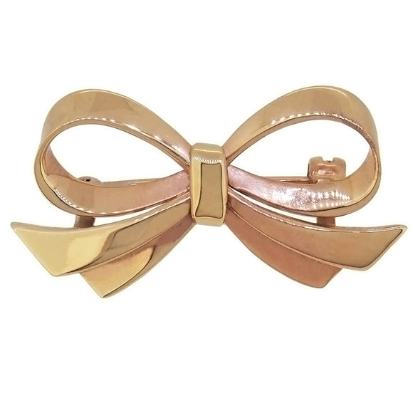 A modern, 9ct yellow gold bow brooch