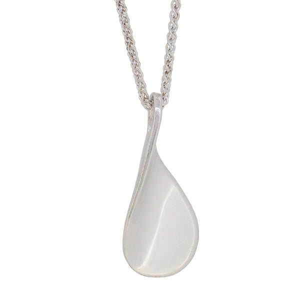 A modern, silver, abstract pendant