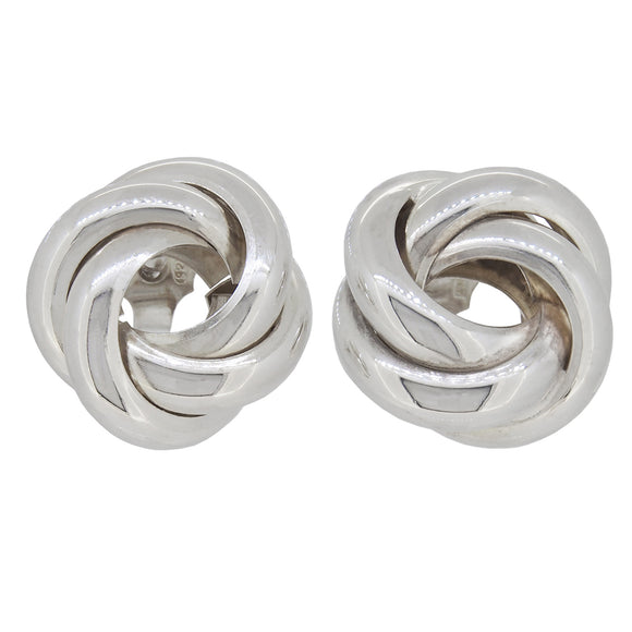 A pair of modern, silver, knot stud earrings