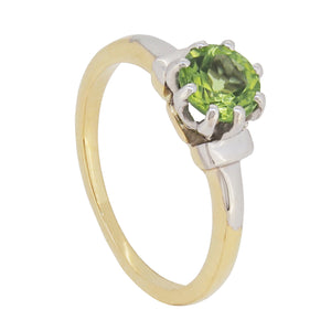 A mid-20th century, 18ct yellow gold & platinum, peridot set single stone ring