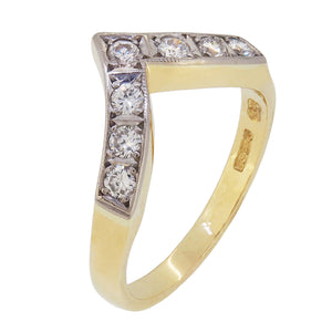 A modern, 18ct yellow gold, diamond set, seven stone, 'V' shaped half eternity ring