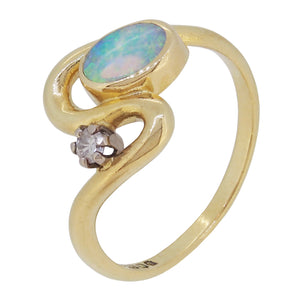 A modern, 18ct yellow gold, opal & diamond set, two stone, Art Nouveau style crossover ring