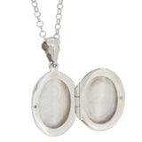 A modern, silver, engraved, oval locket open & chain