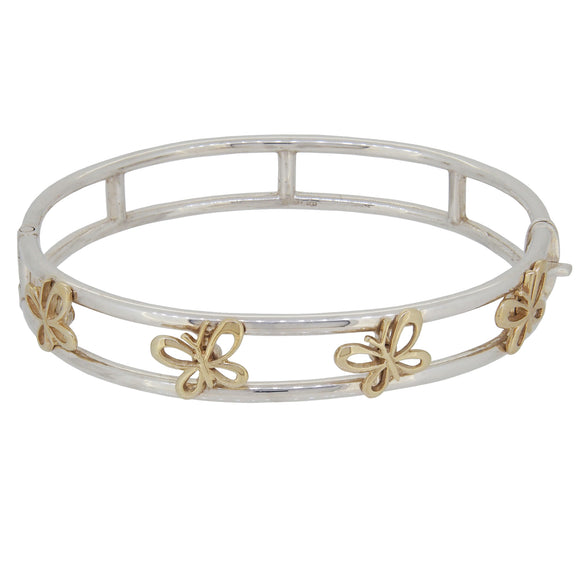 A modern, silver & silver gilt, hinged bangle with butterfly decorations