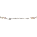 A modern, single row of cultured freshwater pearls on a silver trigger.
