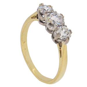 A modern, 18ct yellow gold &amp; platinum setting, diamond set three stone ring