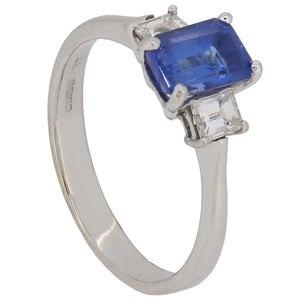 A modern, 18ct white gold, tanzanite & diamond set three stone ring.