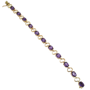 A modern, 18ct yellow gold, amethyst set, eleven stone bracelet