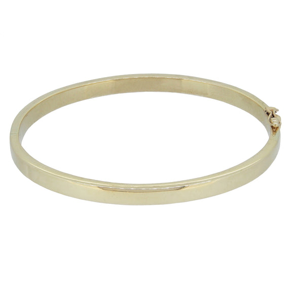 A modern, 9ct yellow gold, solid hinged bangle