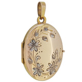 A modern, 9ct, yellow & white gold, floral oval locket