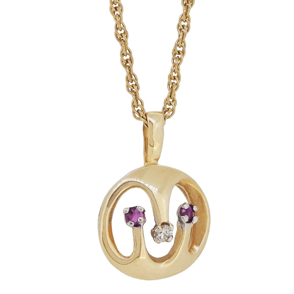 A modern, 9ct yellow gold, ruby & diamond set open, circular pendant & rope chain
