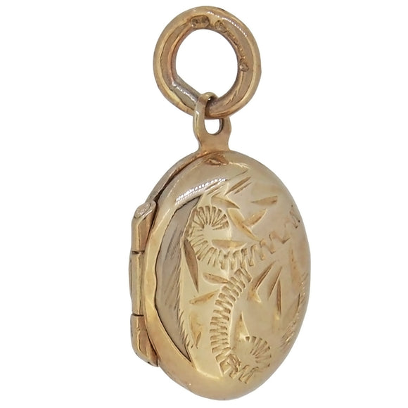 A modern, 9ct yellow gold, small, engraved oval locket