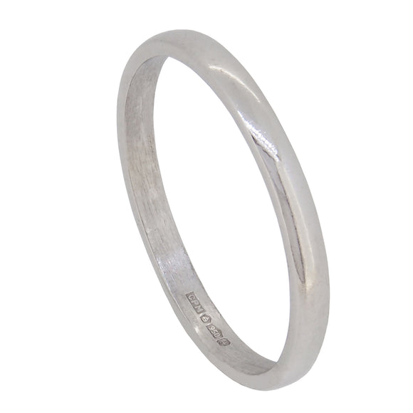 A modern, platinum, D shaped wedding ring