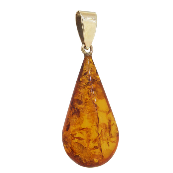 A modern, yellow gold, amber set pear shaped pendant