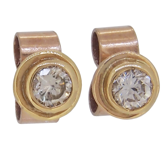 A pair of modern, 9ct yellow gold, diamond set stud earrings