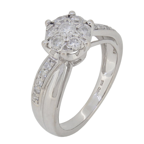 A modern, 9ct white gold, diamond set cluster ring with diamond shoulders