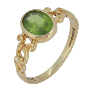 A modern, 9ct yellow gold, peridot set, single stone ring