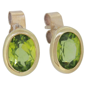 A pair of modern, 9ct yellow gold, peridot set stud earrings