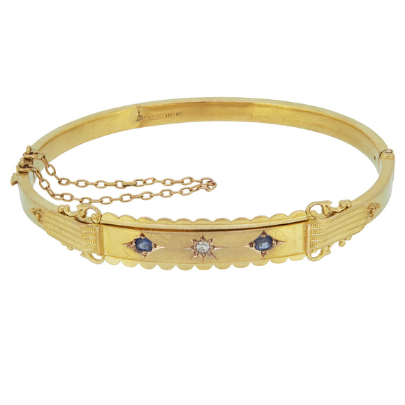 A Victorian, 15ct yellow gold, sapphire & diamond set hinged bangle.