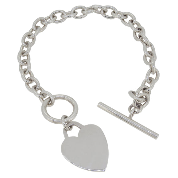 A modern, silver, oval belcher link bracelet with a heart pendant