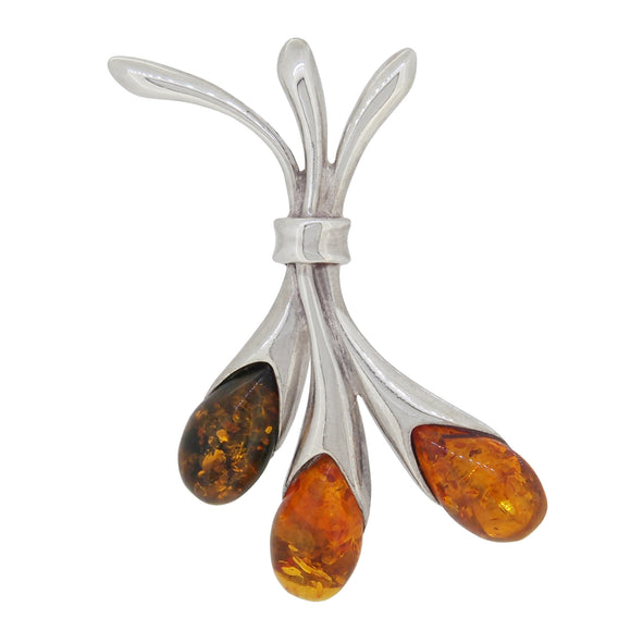 A modern, silver, amber set, three stone pendant