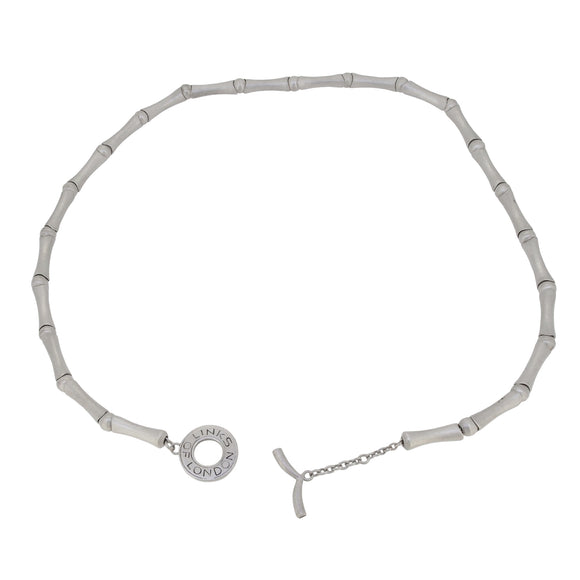 An modern, silver, bamboo style collar