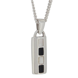 A modern, silver, black onyx & mother of pearl set pendant & chain.