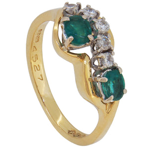A modern, 18ct yellow gold, emerald & diamond set, seven stone abstract ring.
