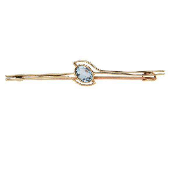 An early 20th century, 15ct yellow gold, aquamarine set, single stone bar brooch