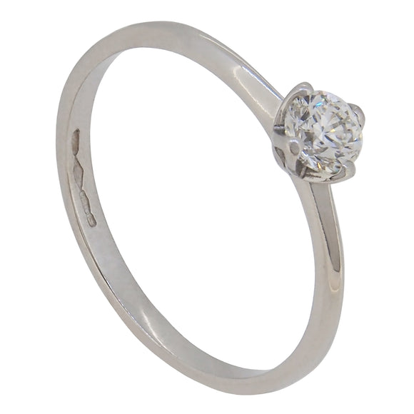A modern, platinum, diamond set, single stone ring