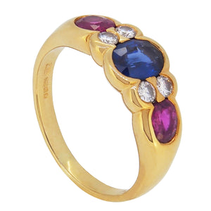 A modern, 18ct yellow gold, sapphire, ruby & diamond set seven stone ring.