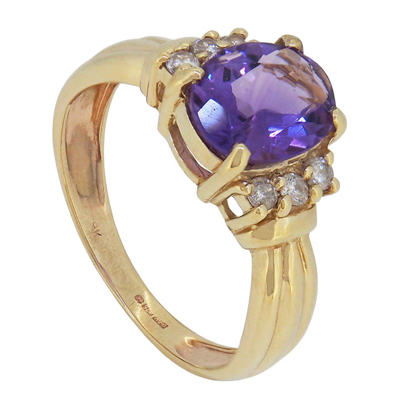 A modern, 9ct yellow gold, amethyst & diamond set, seven stone ring