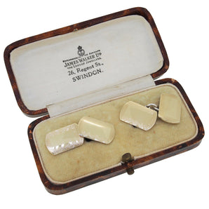A pair of mid-20th century, silver & gold topped, rectangular, chain link cufflinks with engraved borders & fitted case.