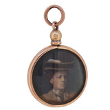 An Edwardian, 9ct rose gold, open, double sided photograph locket with two photos of a young lady and an older lady.