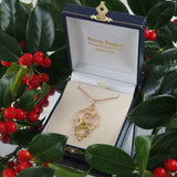 An Edwardian, yellow gold, peridot & pearl set pendant & chain.