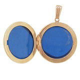A modern, 9ct yellow gold, circular locket with an engraved pattern open