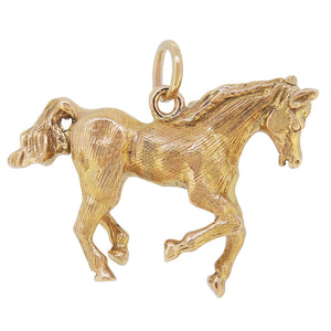 A mid-20th century, 9ct yellow gold horse pendant.