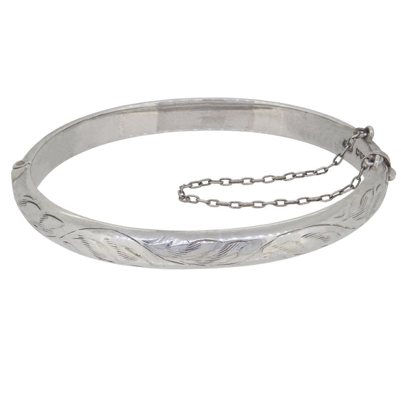 A mid-20th century, silver, half engraved hinged bangle