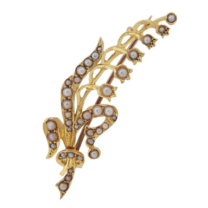 An Edwardian, 15ct yellow gold, pearl set, lily of the valley brooch.