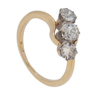 An early 20th century, 18ct yellow gold, diamond set, three stone crossover ring
