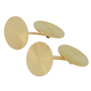 A pair of mid-20th century, yellow gold, circular, bar link cufflinks with concentric circles design.