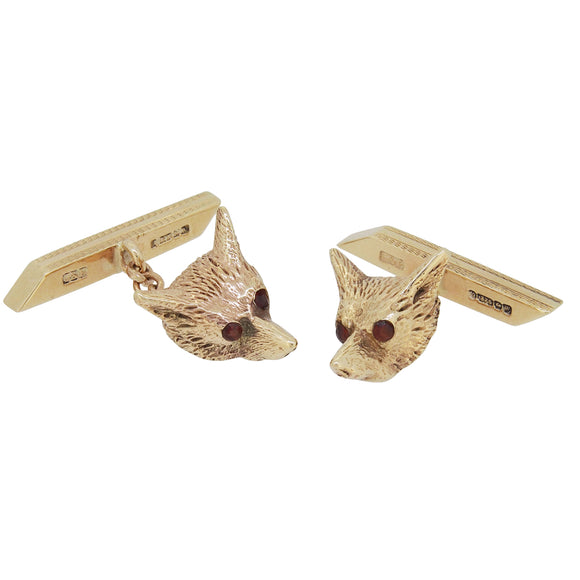 A pair of mid-20th century, 9ct yellow gold, ruby set, fox head cufflinks