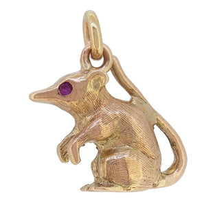 A mid-20th century, 9ct yellow gold, ruby set, mouse charm pendant