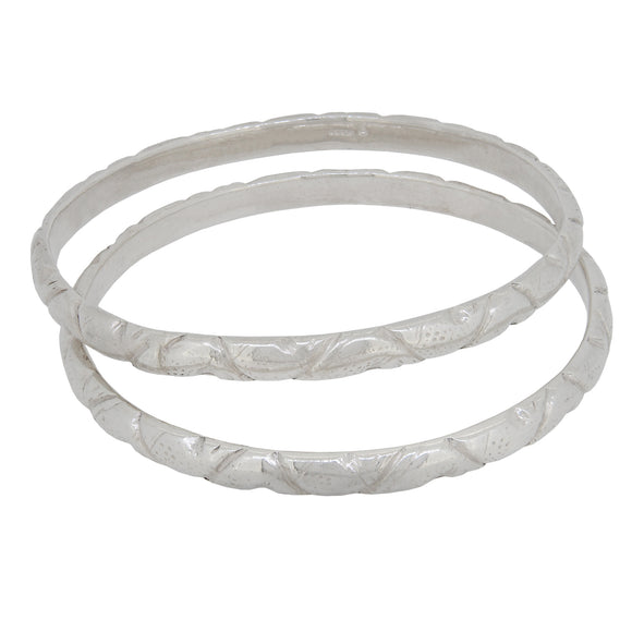 A pair of modern, silver, solid bangles